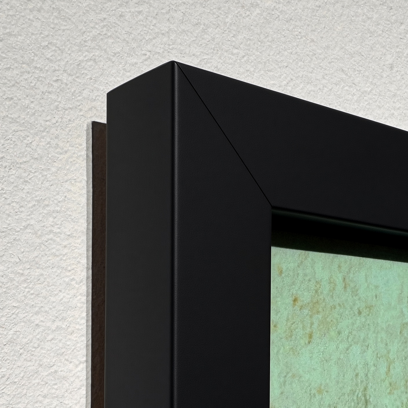 The corner of the matte black frame.